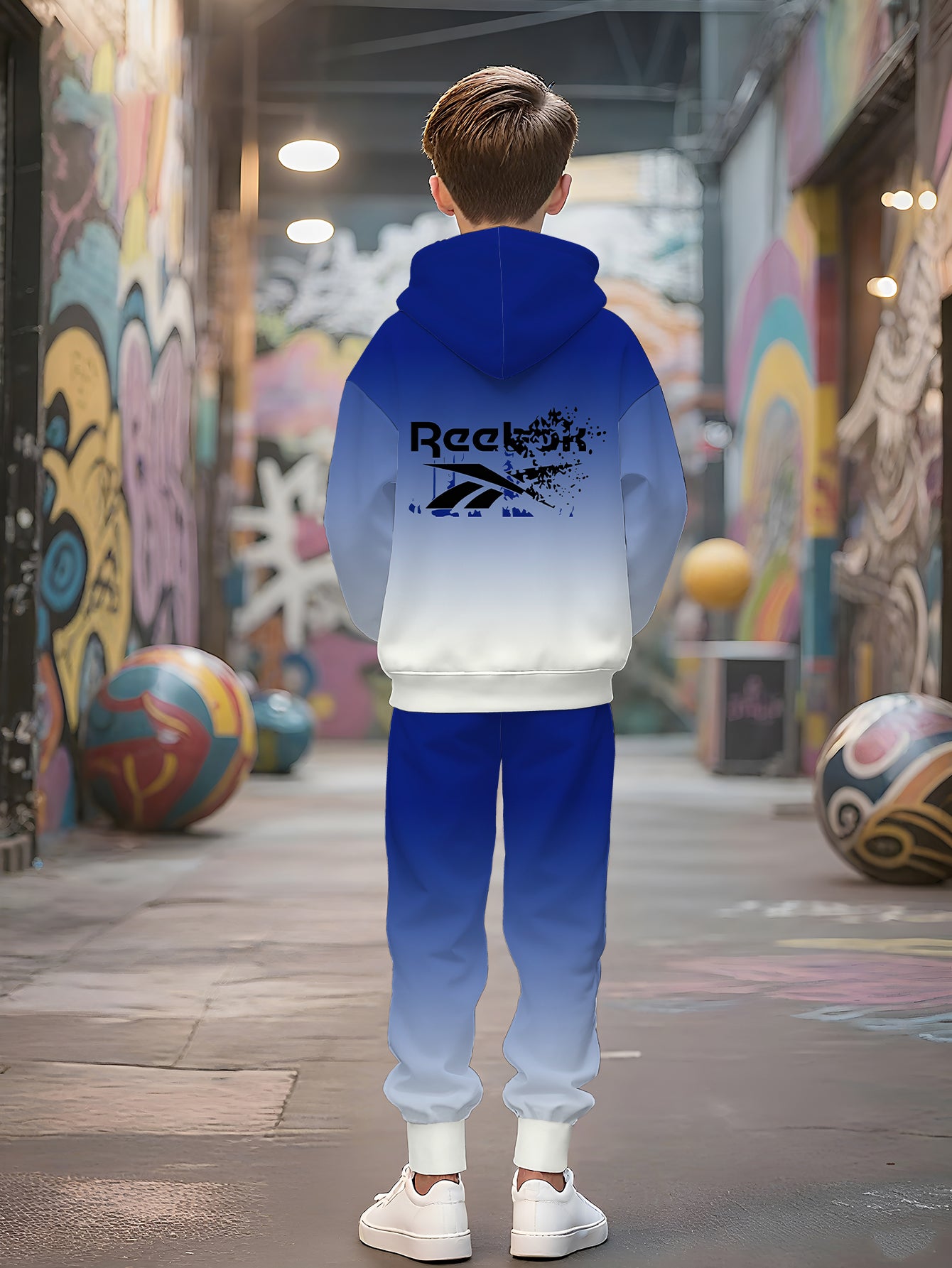Boys' Gradient Hooded Tracksuit Set. This two- piece casual sportswear features a blue- white gradient. It's a themed hooded tracksuit set that showcases a sporty style, making it a trendy and comfortable choice for boys in s