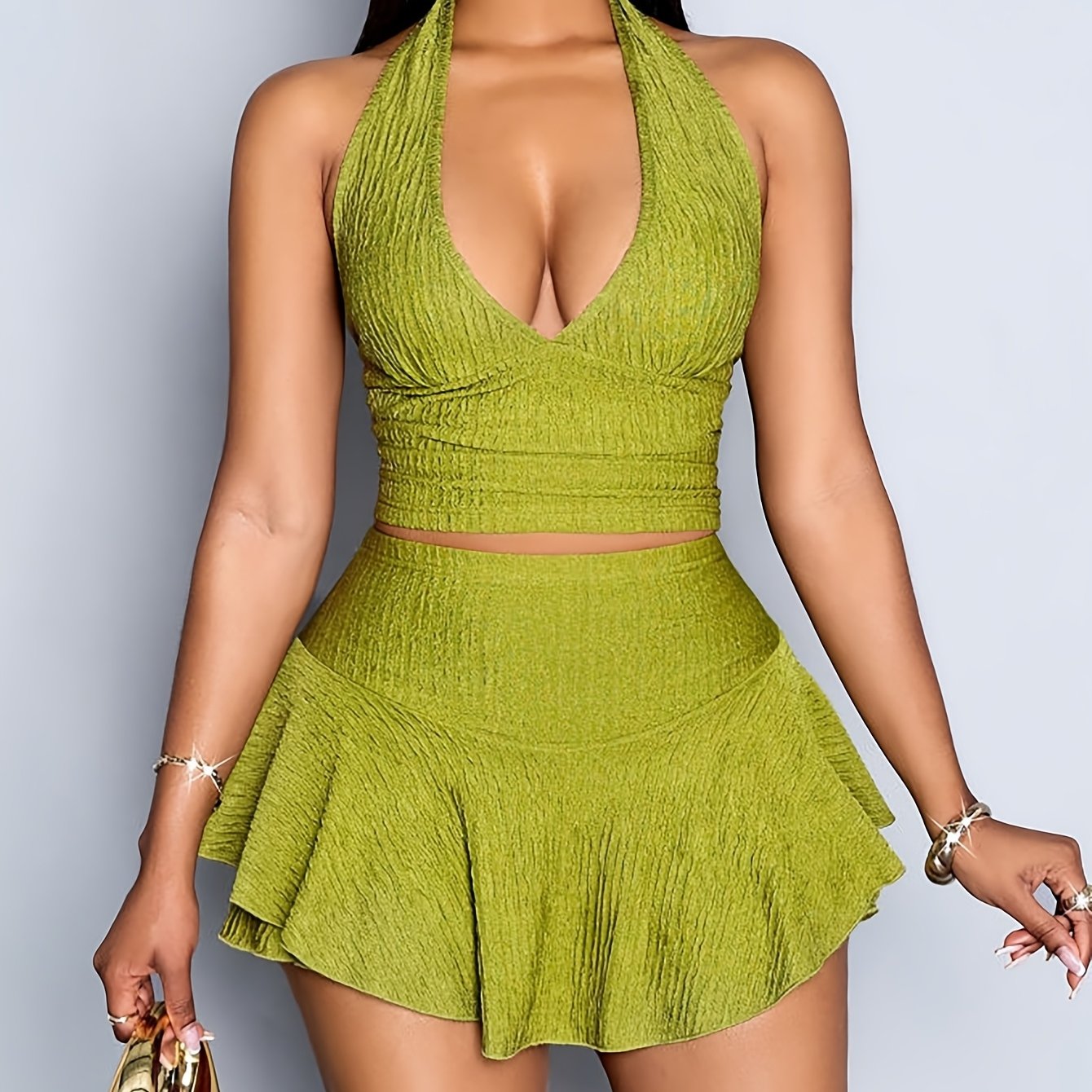 A Versatile Backless Outfit Featuring a Deep V-Neck Top And a Skirt with Pants